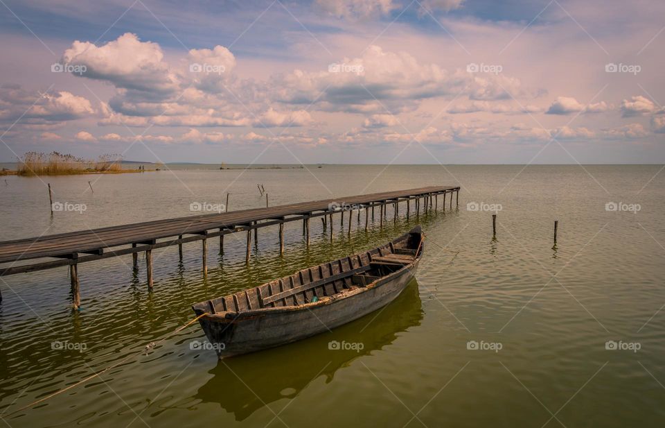 Wooden bridge and wooden boat