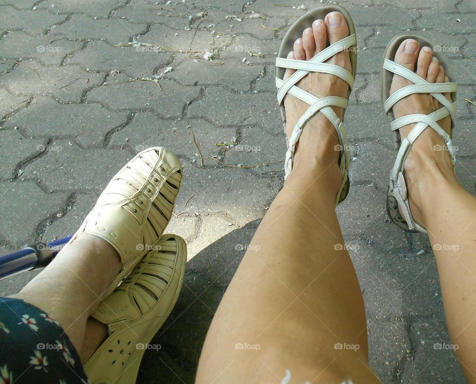 two woman's leg's shoes, female friends