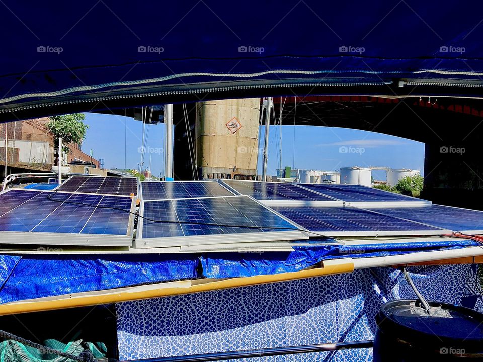 The solar panels on the roof Timothy built over the back deck of the “Salvation” harnesses the sun’s energy during the daylight hours. Several deep cycle batteries store it so it’s available for use during the night. 2021. Hypnotic Productions