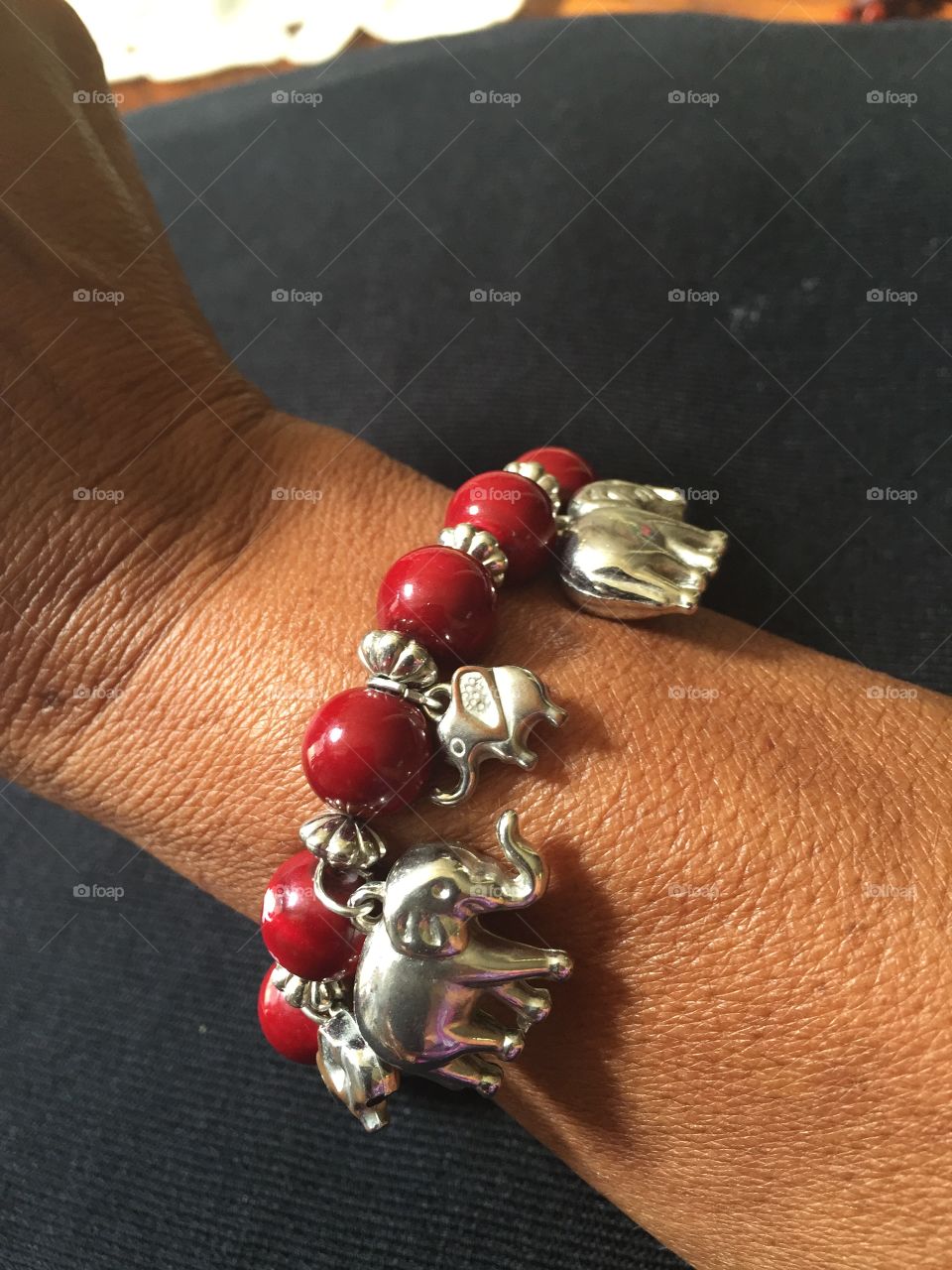 Red beads and silver elephants bracelet 