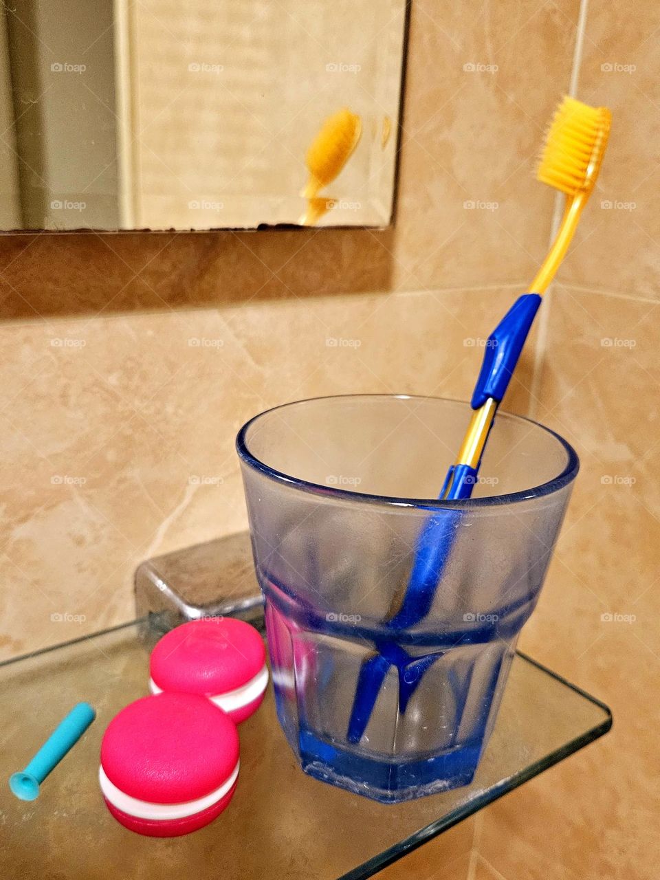 Bathroom mirror, contact lens case, toothbrush, mouthwash cup
