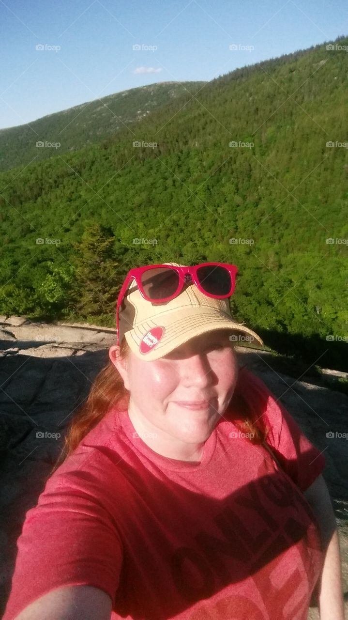 Hiker exploring her own wild ways in the heart of Acadia National Park. The air up here.