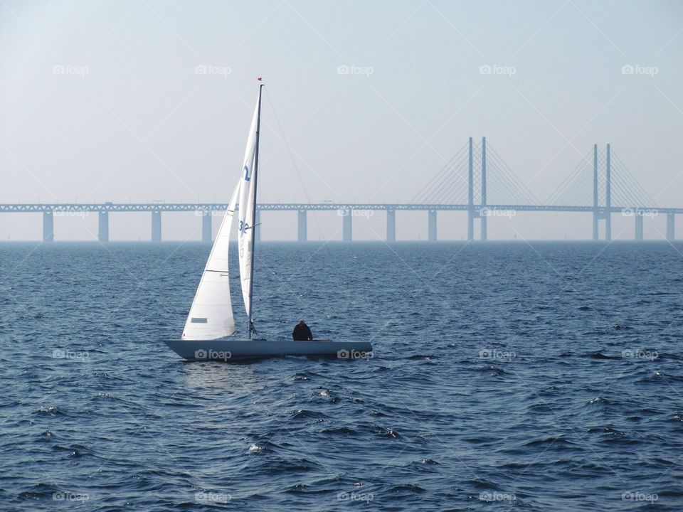 Sailing by the bridge.