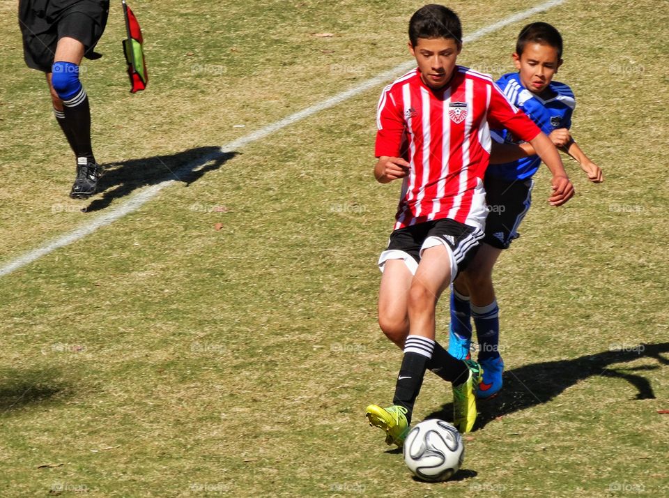 Love Running. Young Soccer Players
