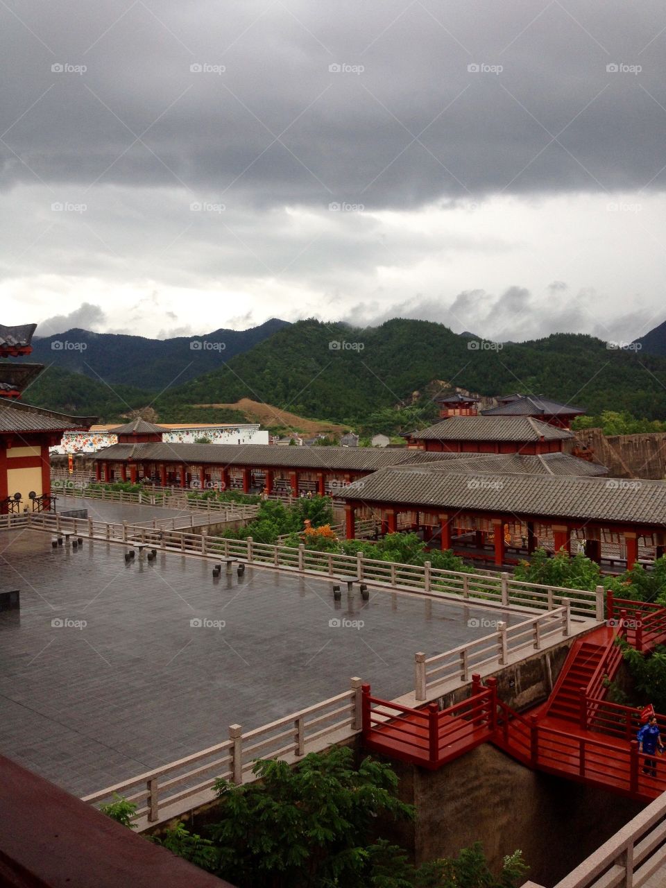 Traditional Chinese Palace on a rainy day with a view on mountains 