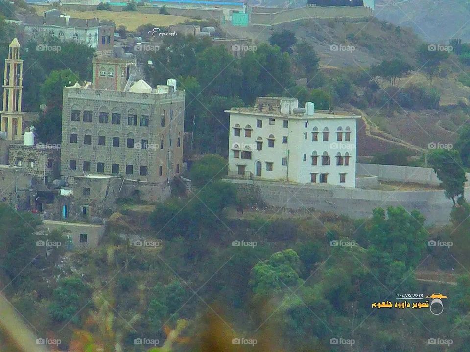 A stunning view of green mountains covered in fog in Yemen