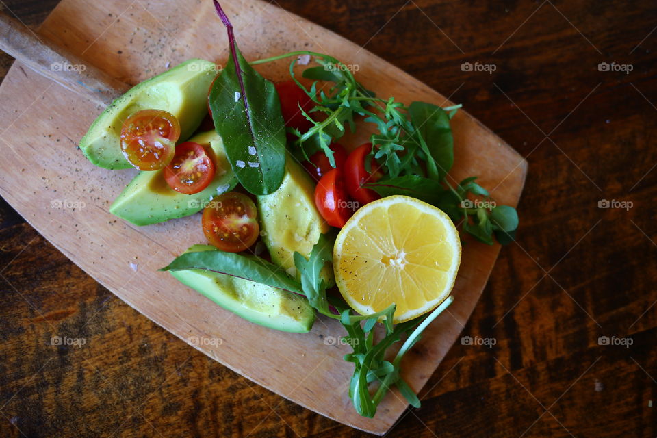 Salad on a wooden tray