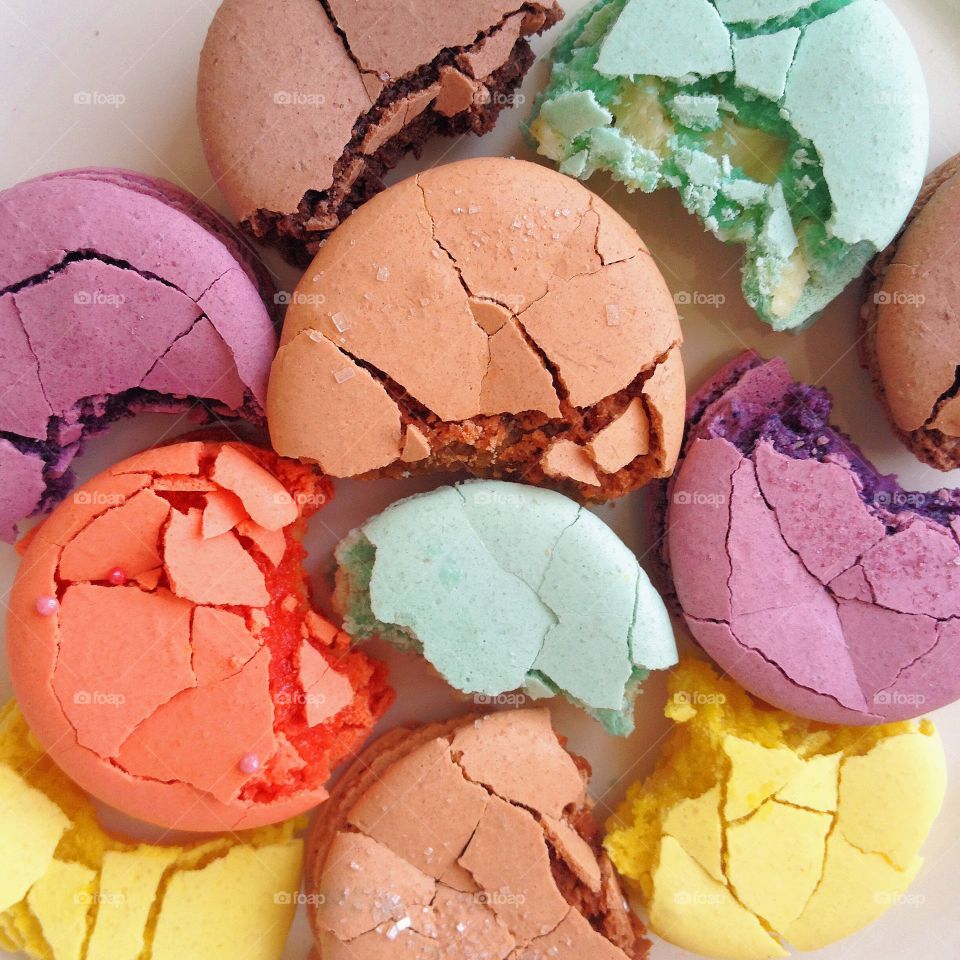 Close-up of broken colored macarons