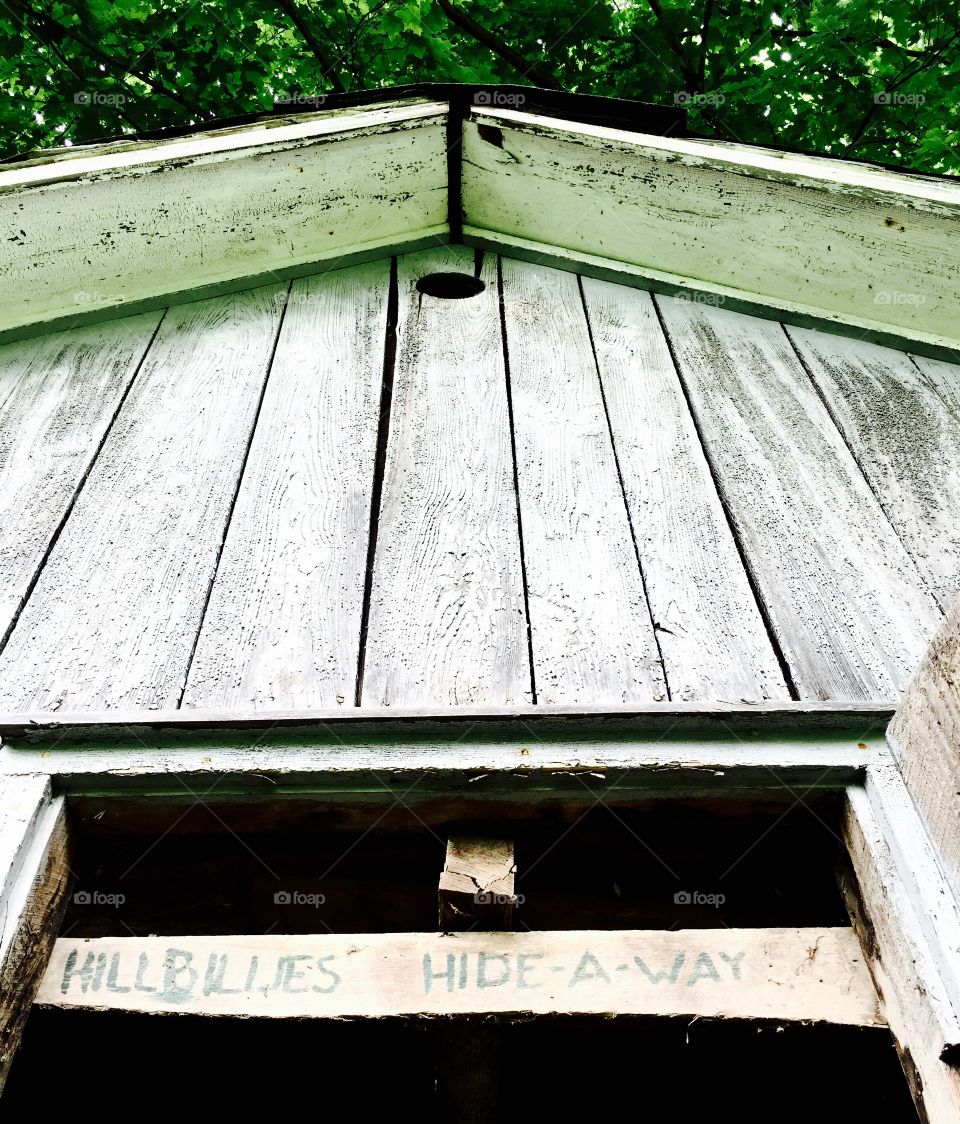 Asymmetric vintage wooden cottage  