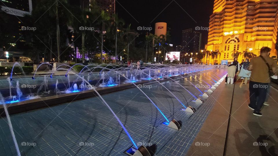 Colourful water spray s at night in KLCC Malaysia