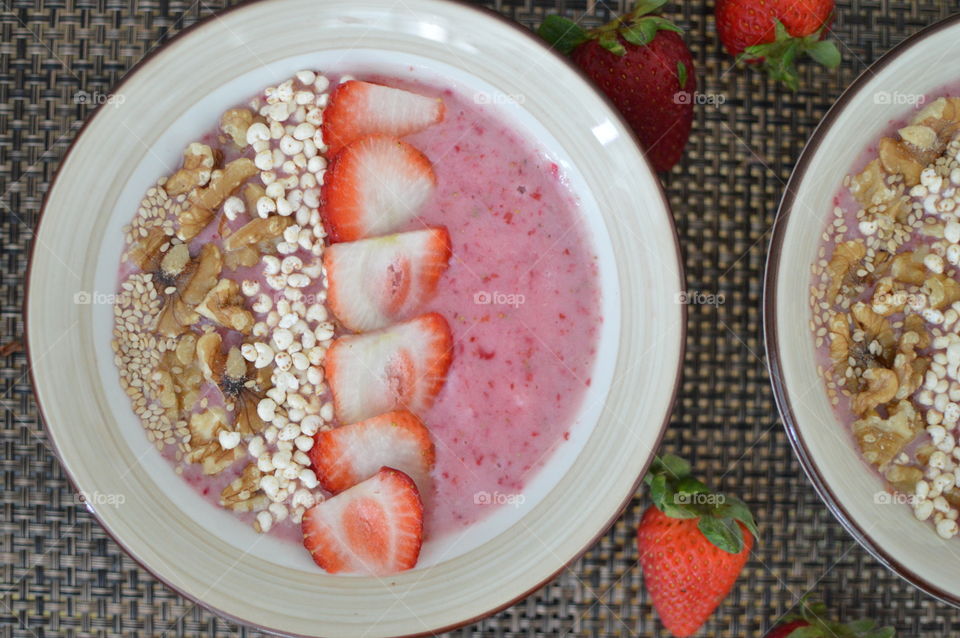 Smoothie in bowl with strawberry