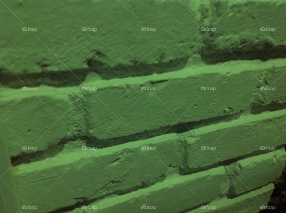 A green brick wall.