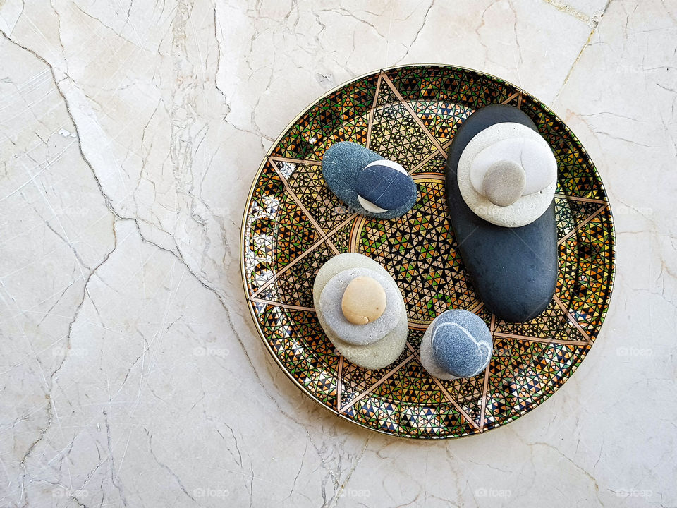 colourful pebbles arranged on a beautiful plate