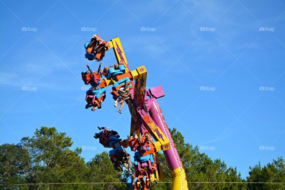 Life in Motion - They hurtle through the sky as rich scents waft through the air. The place is alive with booming music, exhilarated screams and laughter 