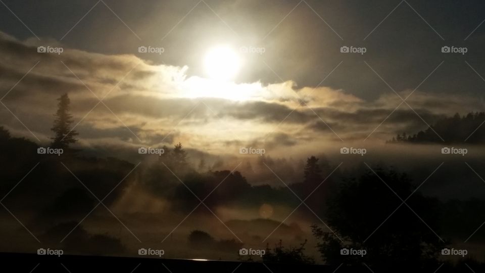 sun rise above cloudy landscape