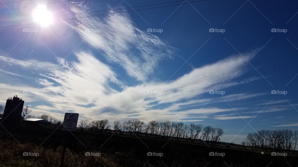 blue skys wispy clouds