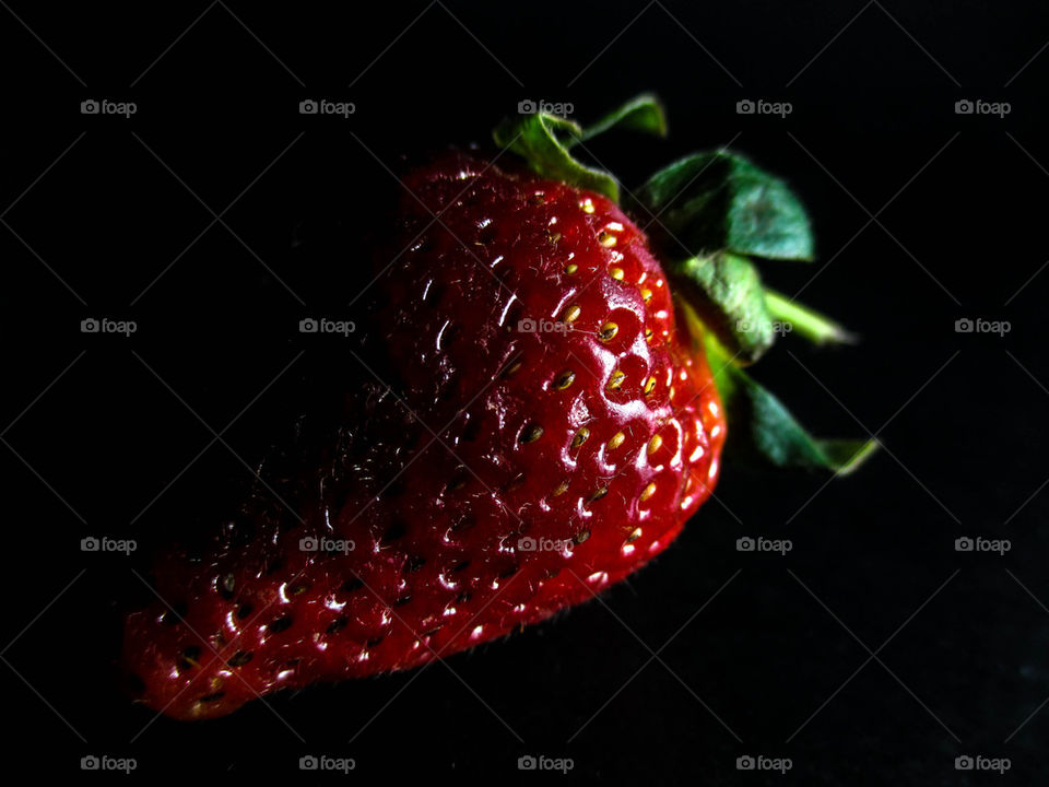 strawberry in dark shot