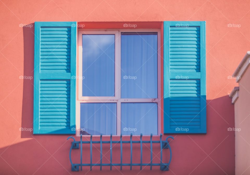 Window of a Spanish or Caribbean inspired home. Cute!