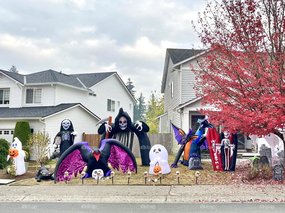 Scary outdoor decorations for the house with monsters, skeletons, ghosts, graves 