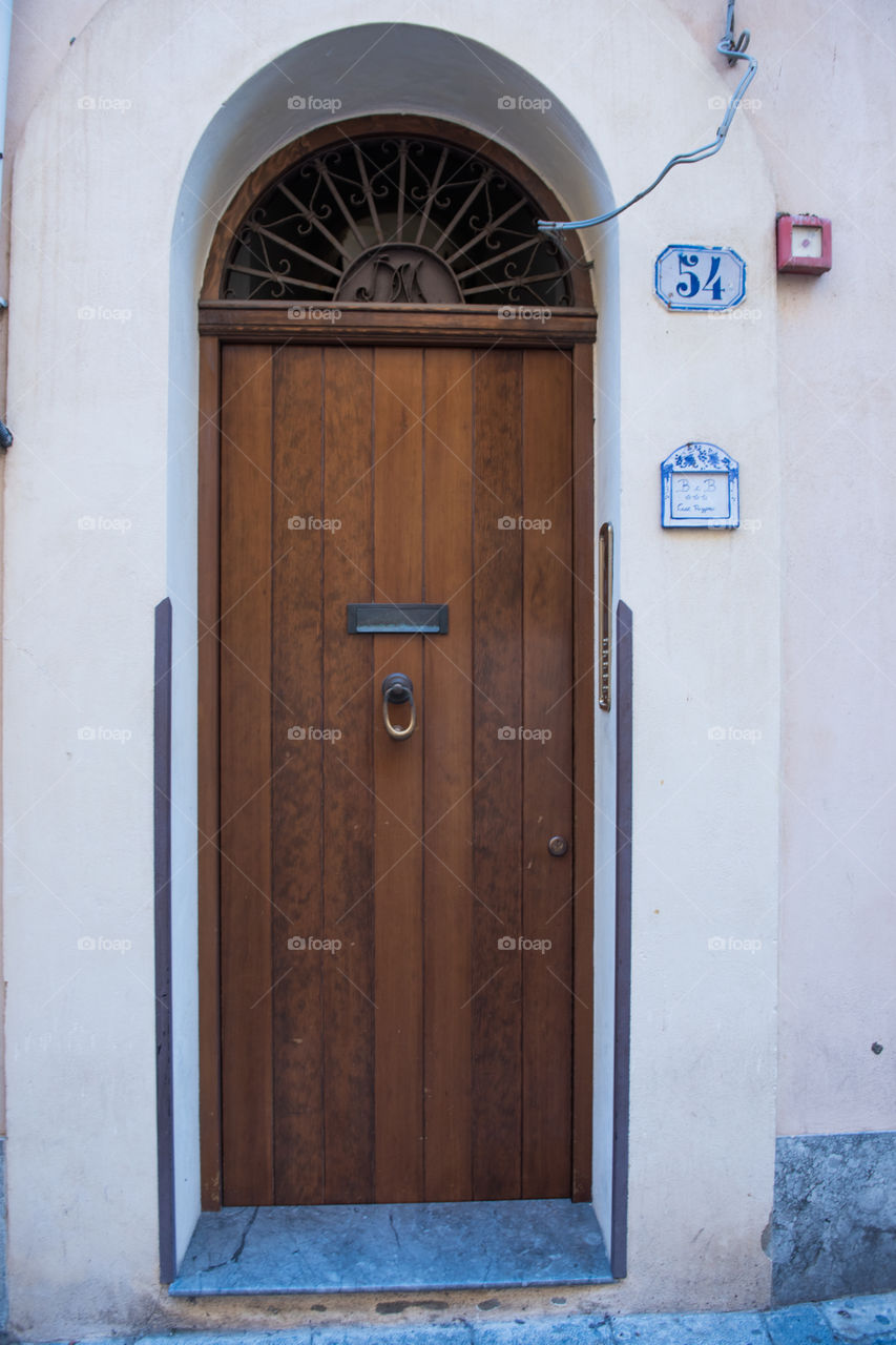 Old door in the city of Cefalu on Cicily.