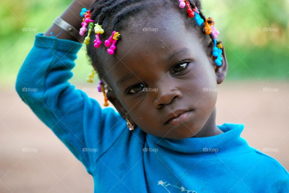 Girl with braided girl and pearls 