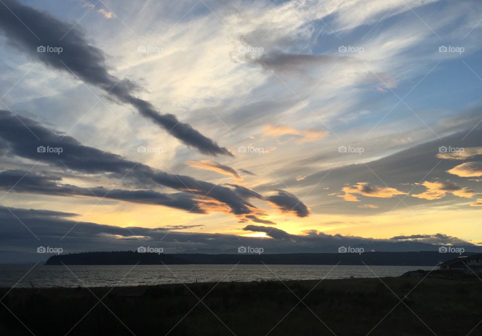 Dramatic sky during sunset over sea