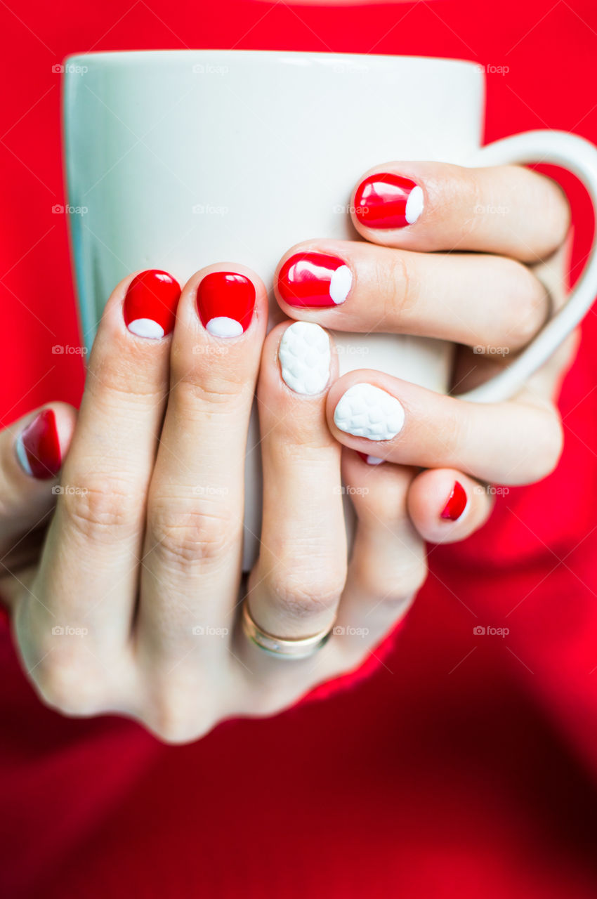 Women holding cup of tea cup