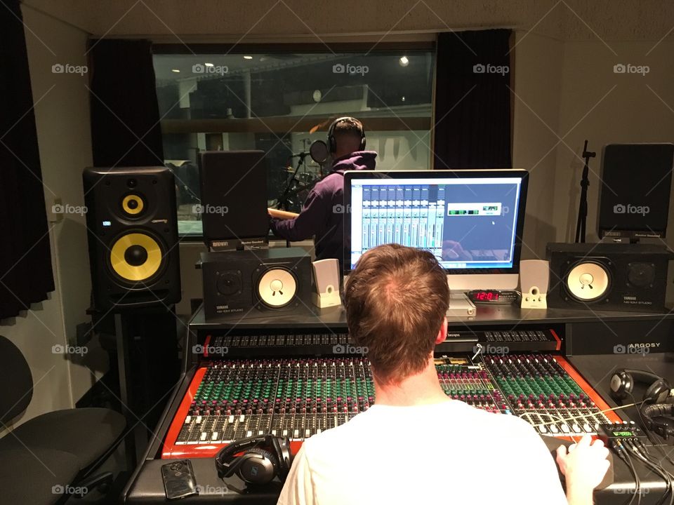 Musician and producer in the recording studio