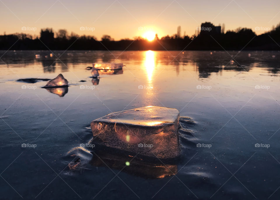 Pieces of ice on frozen lake in winter 