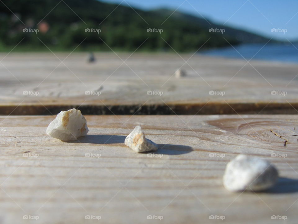 rocks on wooden deck