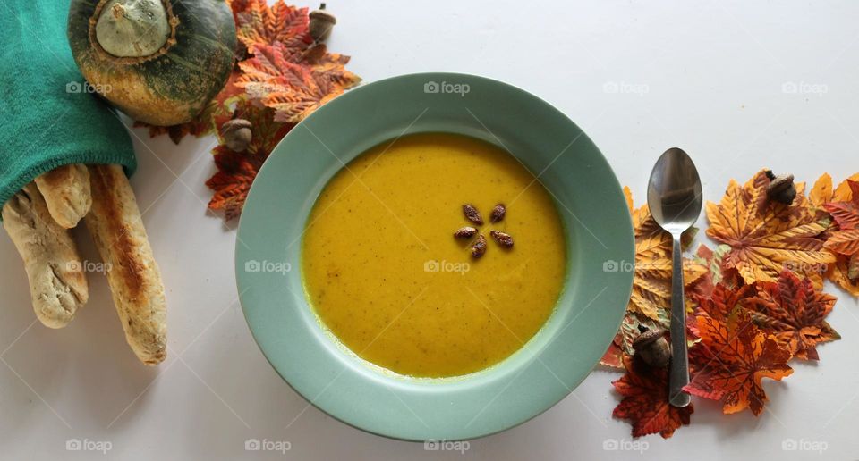 Seasonal cooking: homemade squash soup with breadsticks.