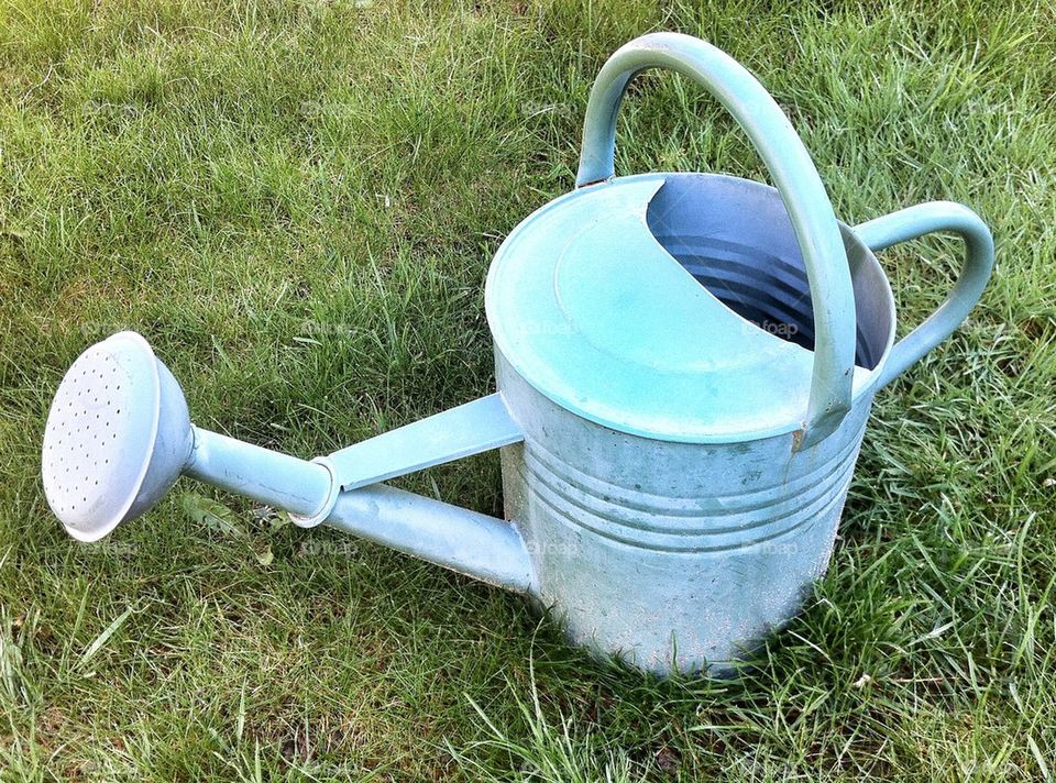 Rustic old watering can