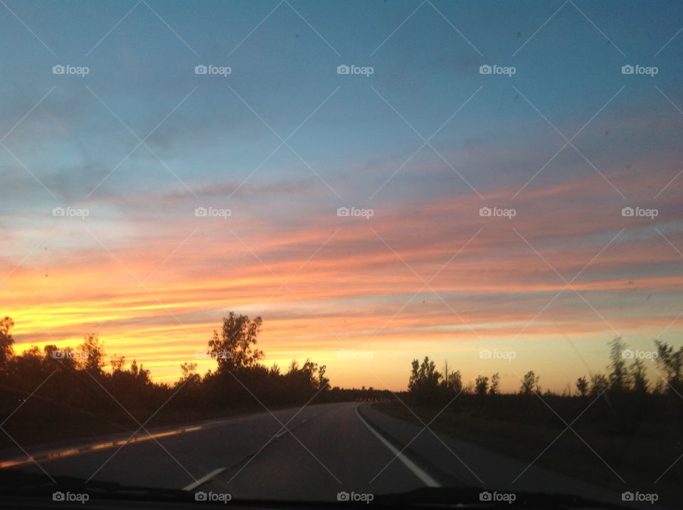 Red Sky at Night. Beautiful sunset above a winding rural road