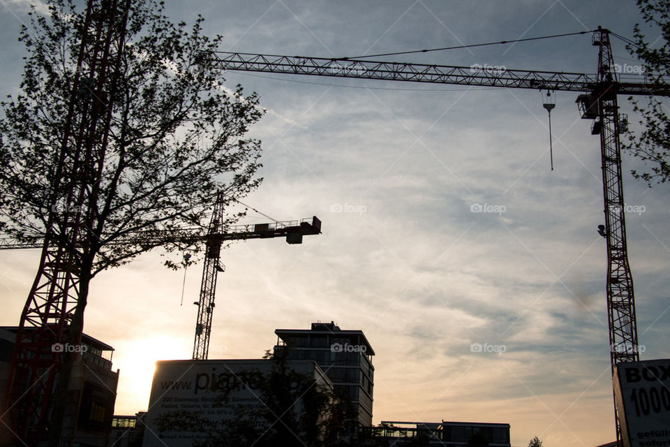 Construction crane at sunset