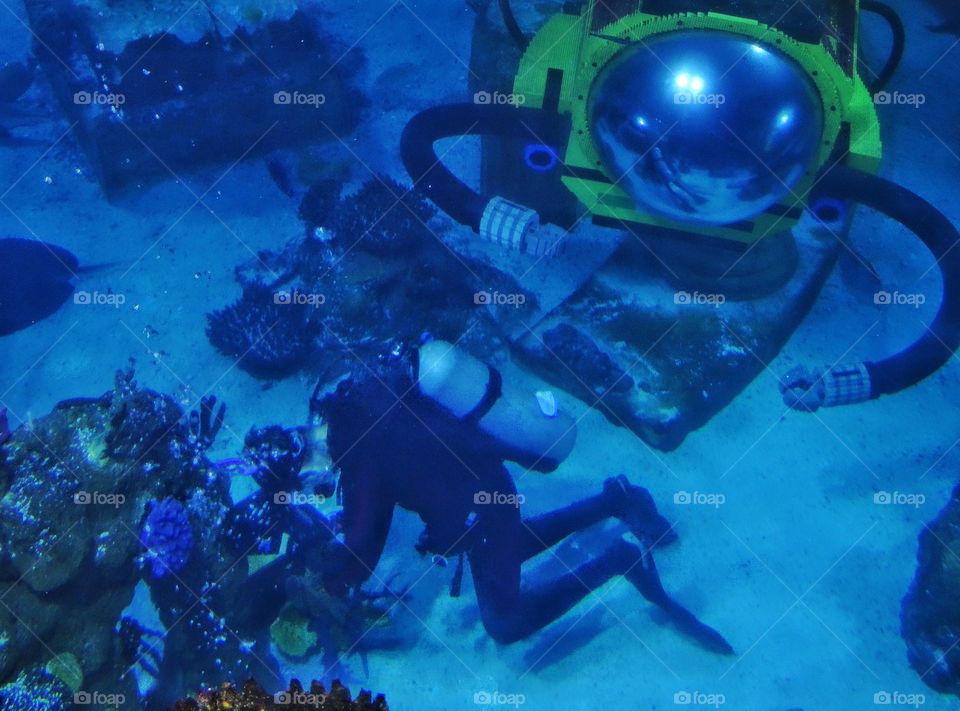 Underwater Exploration. Scuba Diver With Submarine Exploring A Coral Reef
