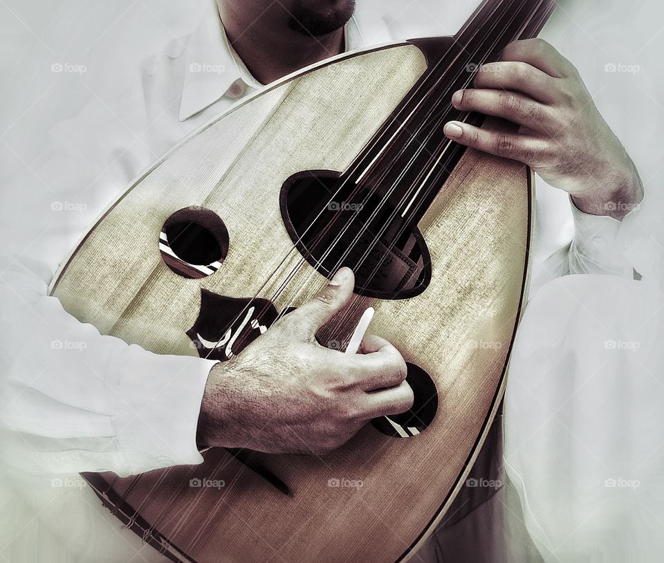 Our. Man playing oud