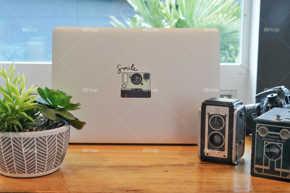 Photographer’s desk with antique cameras