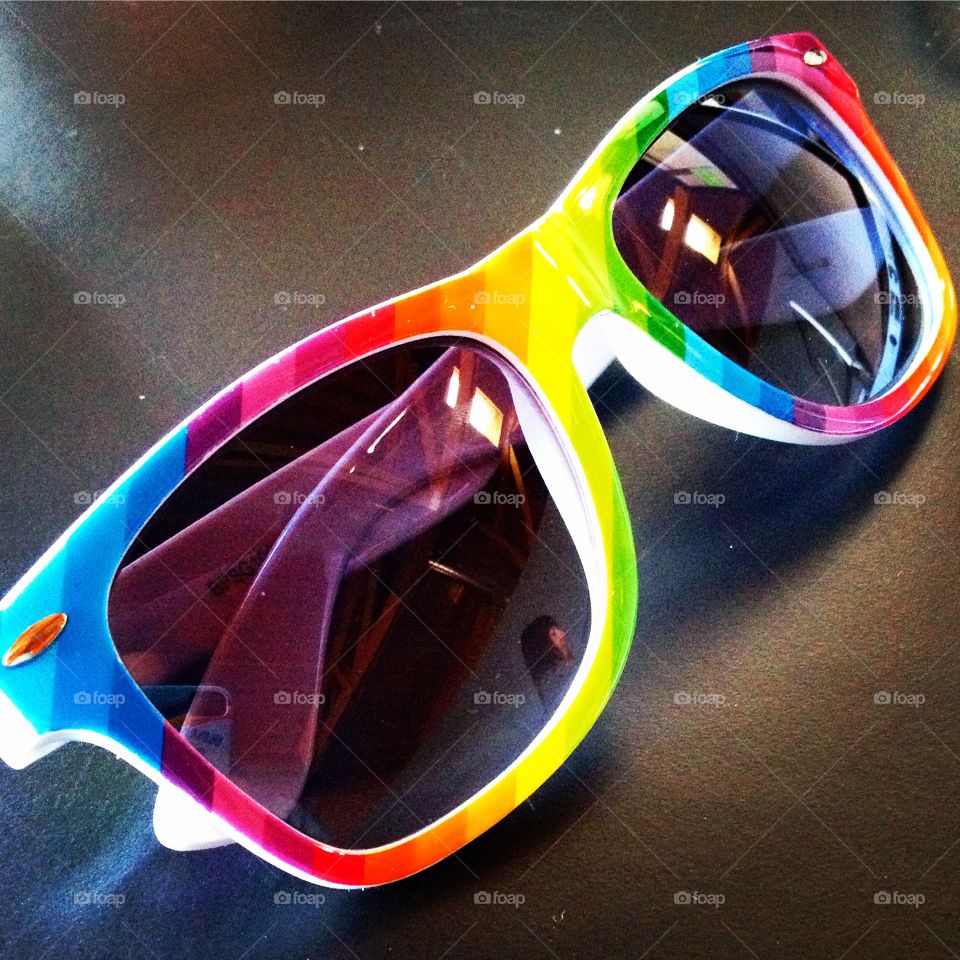 Looking through rainbow lenses. Rainbow sunglasses received as a gift.