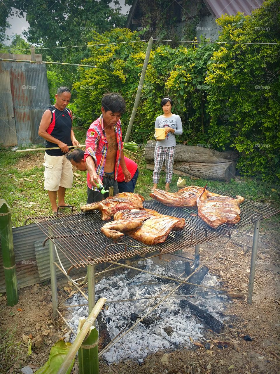 Roast Pork.. The cooking is making a hog roast. And put the seasoning into the meat.