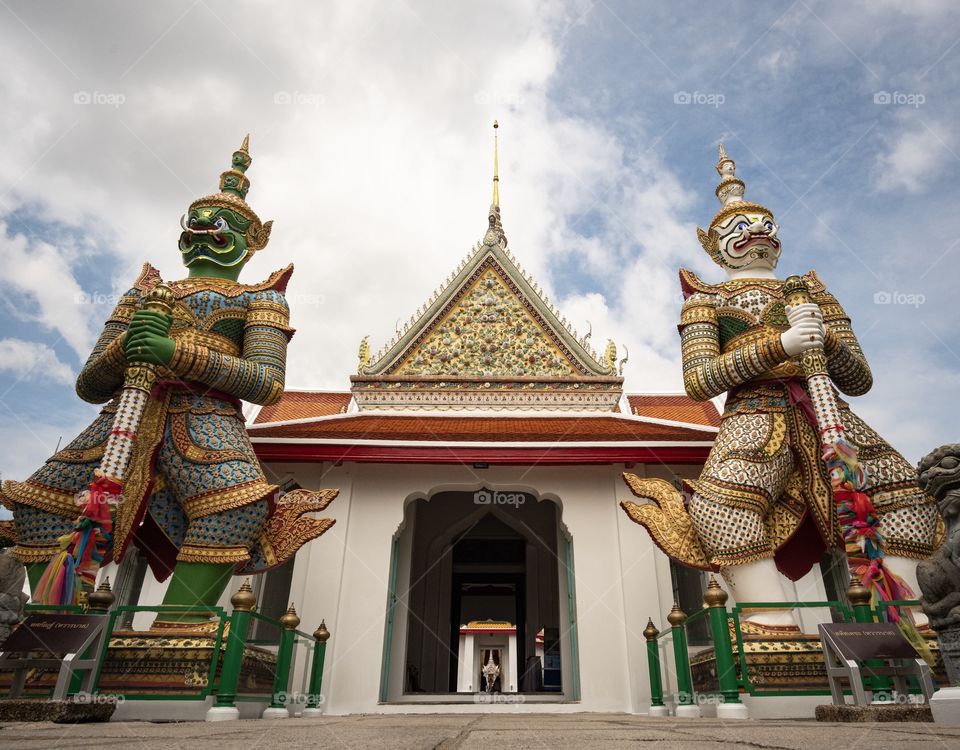 The famous Giant statue of Wat Chaeng (Wat Arun) in Bangkok Thailand is the favorite art for tourists    