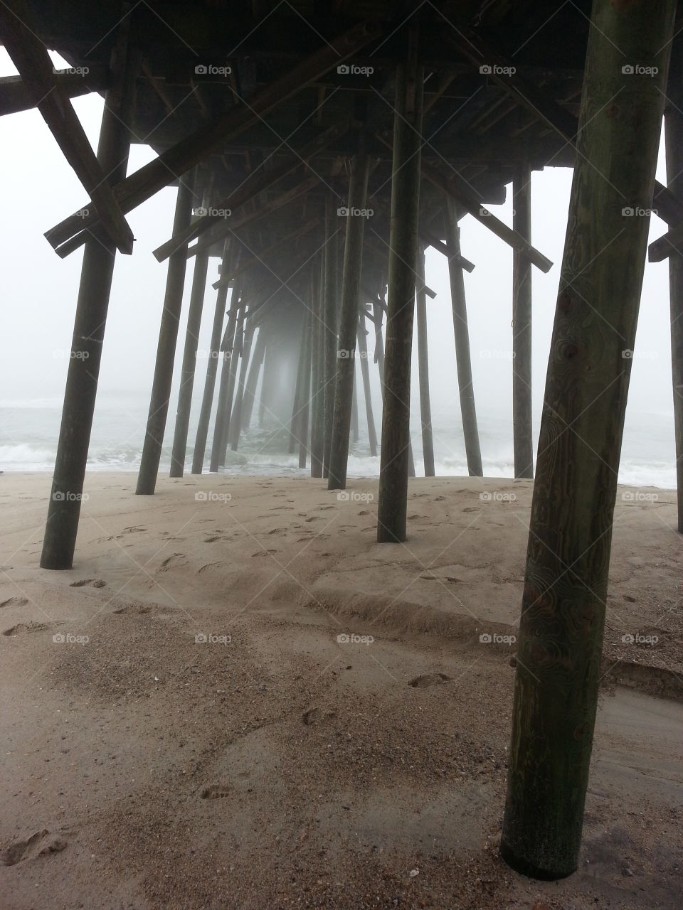 Foggy Pier. Under the Kure Beach pier in Wilmington,  NC on a foggy morning