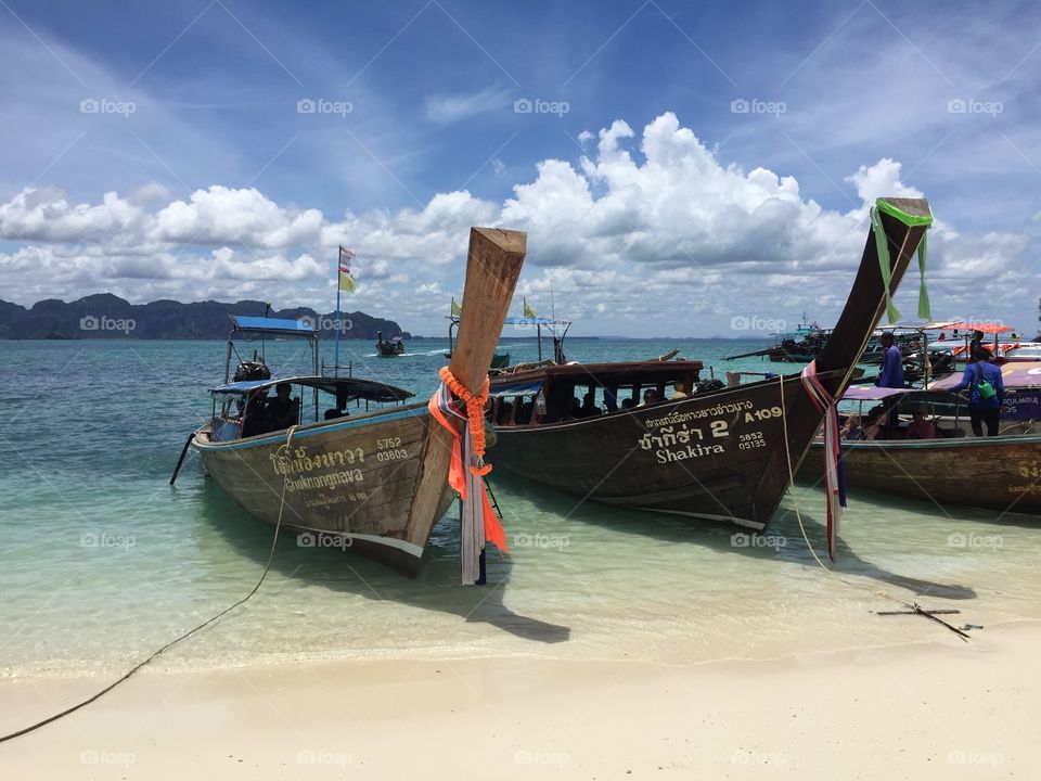 Lovely shot of long tail boats with clear blue skies @ Krabi, Thailand