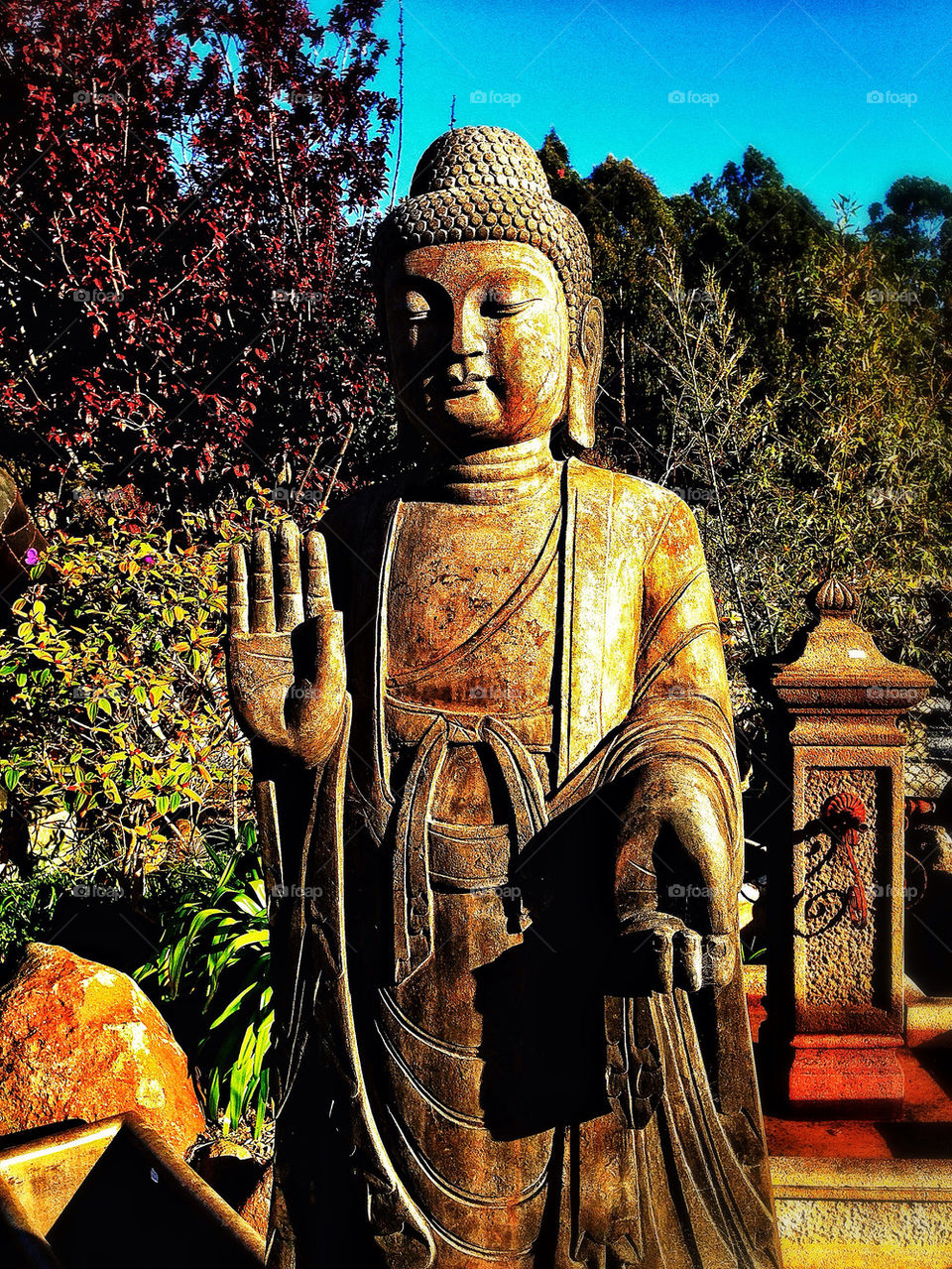 Marble statue of Buddha bodhisattva in a peaceful home garden