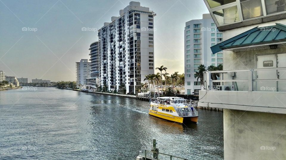 Yellow boat and gray river 