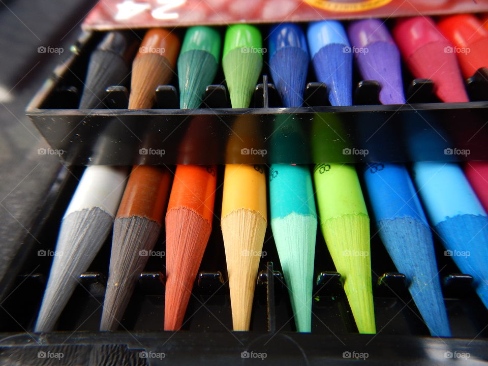 Colorful wax crayons in a row