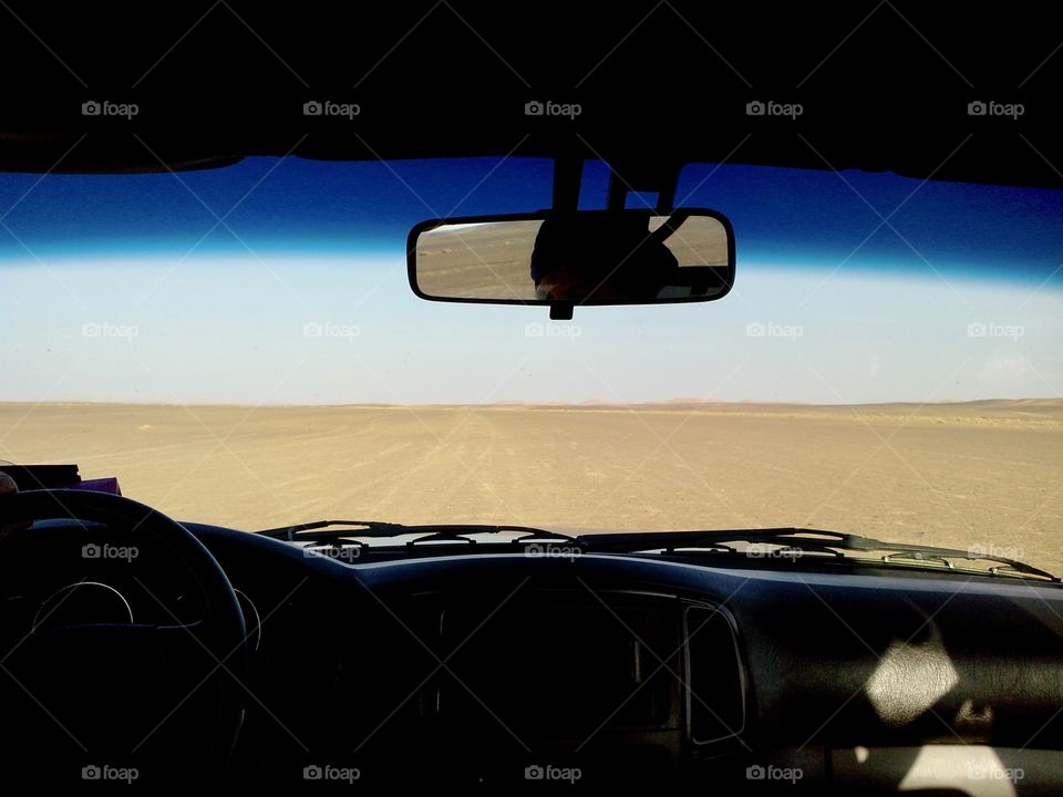 View of a car on the Moroccan desert during a raid