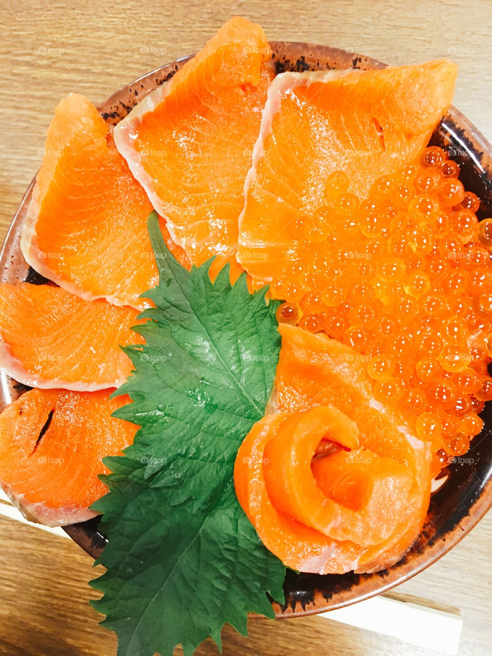 Bowl of fresh salmon sushi and egg