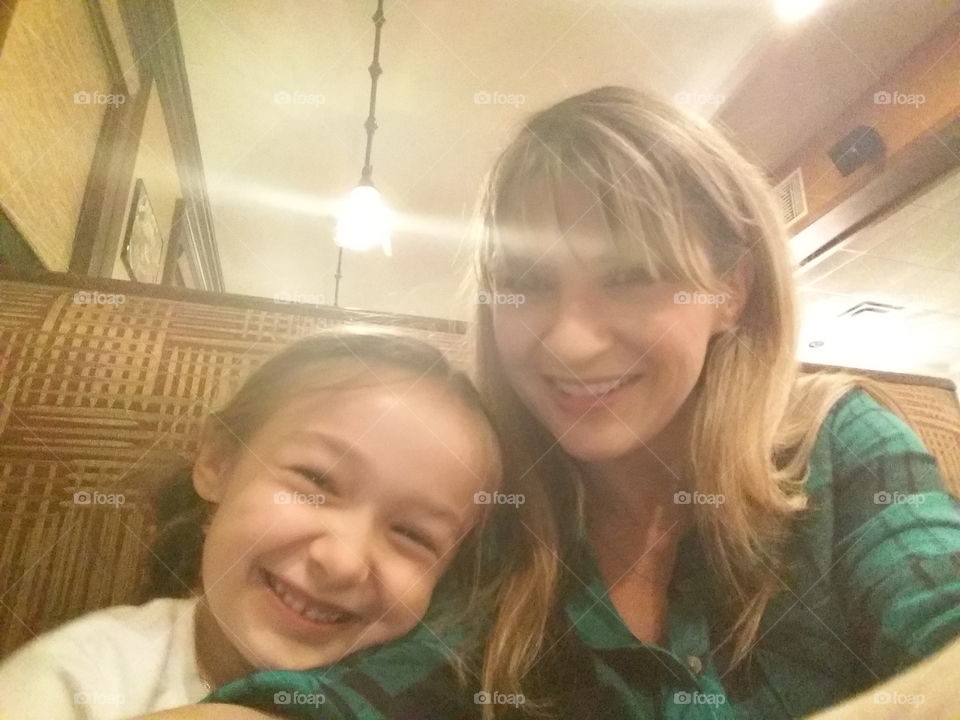 mommy and me. photo of mother and daughter out to eat