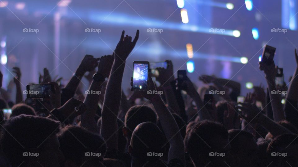 fans at a concert with phones