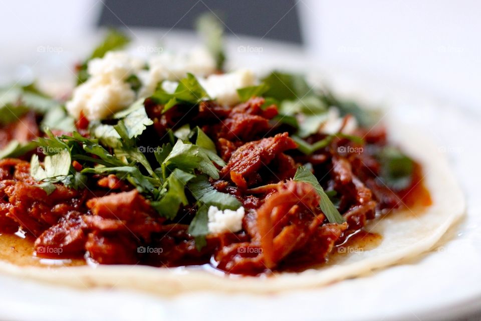 Chilorio tacos with cheese and cilantro 
